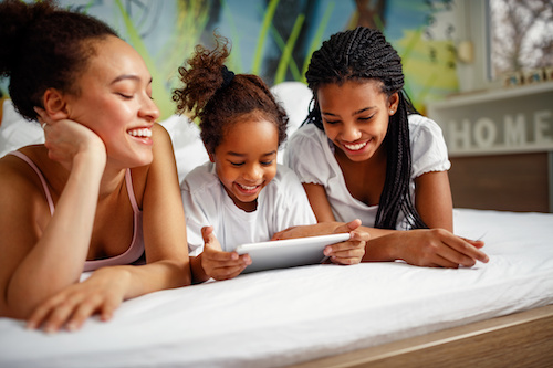 Three children using Mangahigh on a tablet